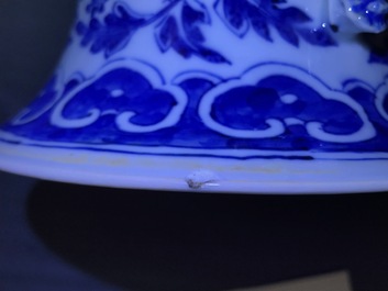 A pair of Chinese blue and white flower scroll vases, 19th C.