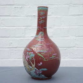 A Chinese oxblood-glazed bottle vase with overglaze design of a dragon and a carp, 19th C.