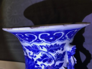 A pair of Chinese blue and white flower scroll vases, 19th C.
