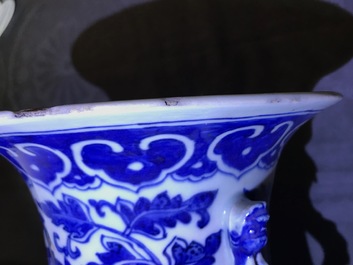 A pair of Chinese blue and white flower scroll vases, 19th C.