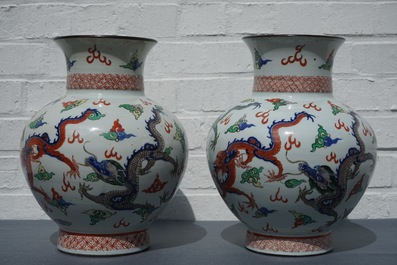 A pair of Chinese wucai dragon vases, Wanli mark, 19th C.