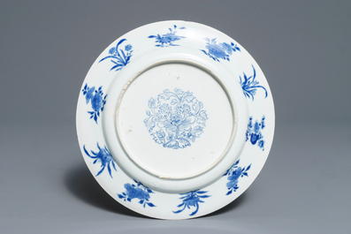 A Chinese blue and white plate with figures in a pagoda, Kangxi