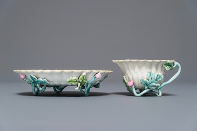 A Chinese famille rose lotus-shaped relief-decorated cup and saucer, Yongzheng