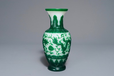 A Chinese green on white Peking glass dragon vase, Qianlong mark, 19th C.