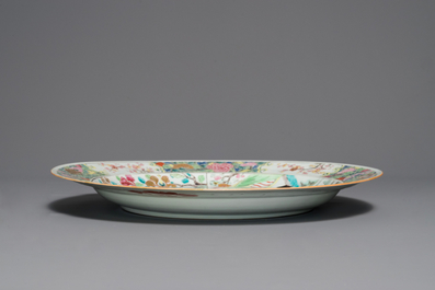 A fine Chinese famille rose dish with figures in a garden, Yongzheng