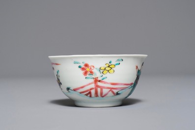 A Chinese famille rose 'Romance of the Western chamber' cup and saucer, Yongzheng/Qianlong