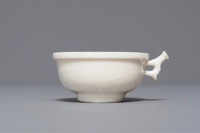 A Chinese Dehua blanc de Chine cup with applied design, Kangxi