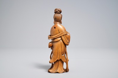 A Chinese carved wood figure of Guanyin standing, 19th C.