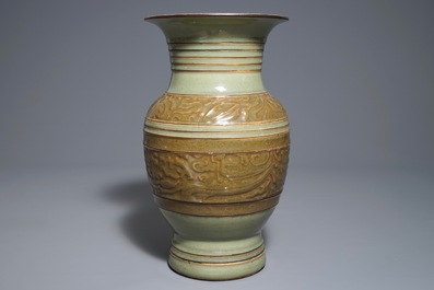 A Chinese archaistic celadon-glazed vase with moulded design, 19th C.