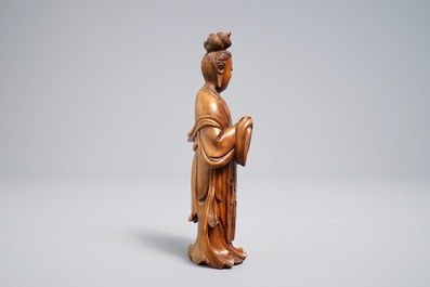 A Chinese carved wood figure of Guanyin standing, 19th C.