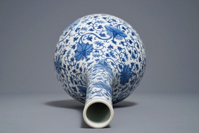 A Chinese blue and white 'lotus scroll' bottle vase, 18/19th C.