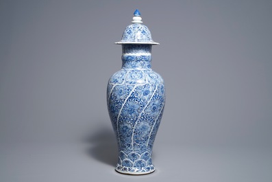 A Chinese blue and white moulded vase and cover with floral design, Kangxi