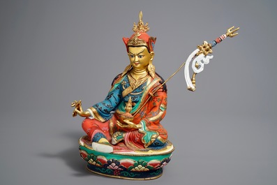 A Sino-Tibetan gilt and polychromed bronze figure of Padmasambhava, 20th C.