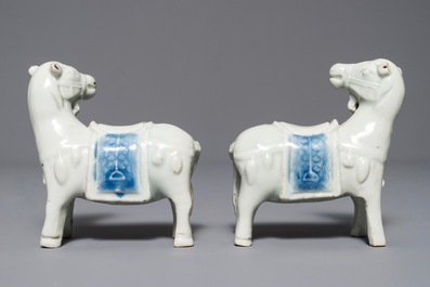 A pair of Chinese blue and white models of horses, Qianlong