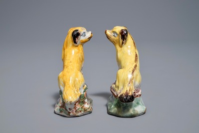 A pair of polychrome Dutch Delft miniatures of dogs, 18th C.