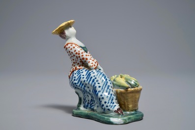 A polychrome Dutch Delft model of a melon seller, 18th C.