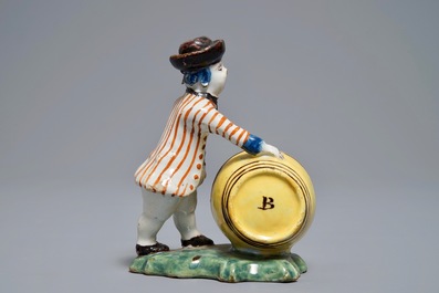 A polychrome Dutch Delft model of a wine merchant, 18th C.