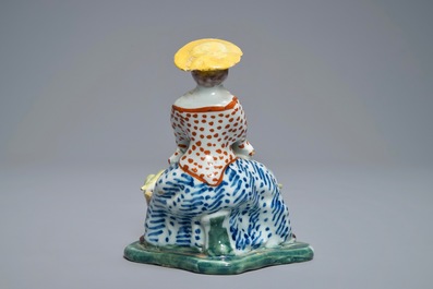 A polychrome Dutch Delft model of a melon seller, 18th C.