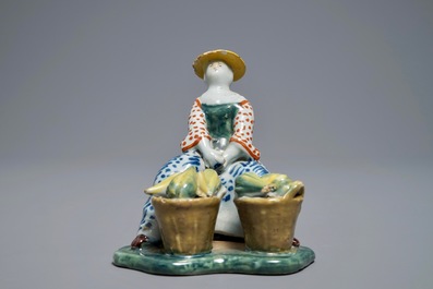 Un mod&egrave;le d'une marchande de melons en fa&iuml;ence polychrome de Delft, 18&egrave;me