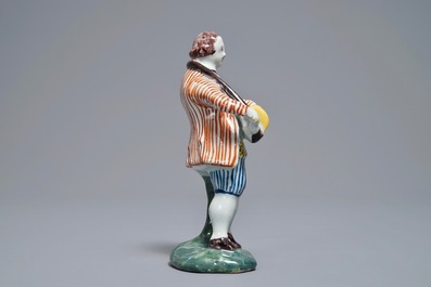 A polychrome Dutch Delft model of a hurdy-gurdy player, 18th C.