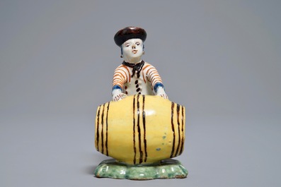 A polychrome Dutch Delft model of a wine merchant, 18th C.