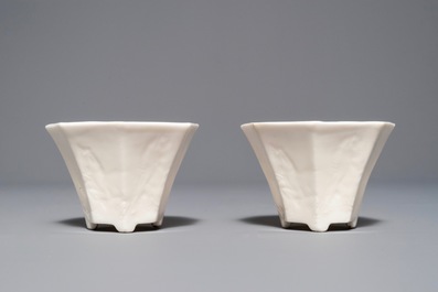 A pair of Chinese Dehua blanc de Chine wine cups with anhua design of horses, Transitional period