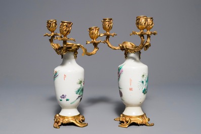 Une paire de vases en porcelaine de Chine famille rose mont&eacute;s comme candelabres, Yongzheng