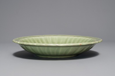 A Chinese Longquan celadon dish with underglaze design, Ming