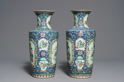 A pair of Chinese famille rose rouleau vases, 19th C.