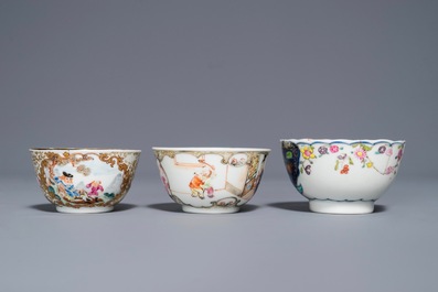 A Chinese famille rose 'Mandarin' cup and saucer and two cups, Yongzheng/Qianlong