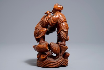 A Chinese carved bamboo group of two playing boys, 19/20th C.