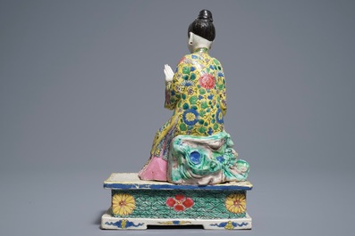 A Chinese famille rose model of a seated lady, Yongzheng
