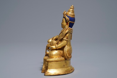 A Sino-Tibetan gilt bronze figure of Jambhala, 19/20th C.