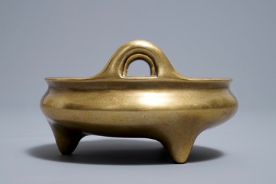 A Chinese bronze tripod censer, Xuande mark, 18th C.