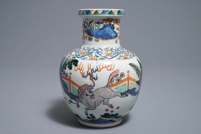 A Chinese wucai 'mythical beasts' vase, 19/20th C.