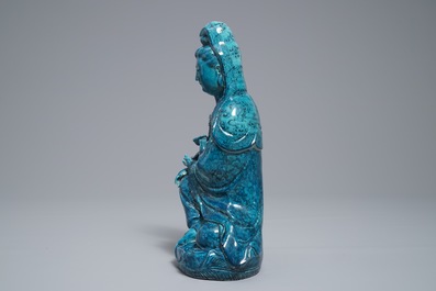 A Chinese turquoise-glazed and underglaze blue model of Guanyin, 19/20th C.