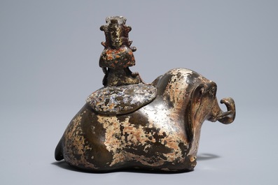 A Chinese bronze incense burner modelled as an elephant with female rider, Ming