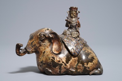 A Chinese bronze incense burner modelled as an elephant with female rider, Ming