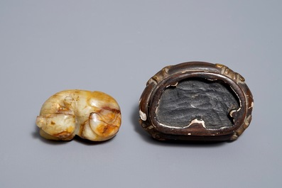 A Chinese celadon and russet jade carving of a tiger, Ming