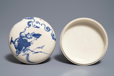 A Chinese blue and white seal paste box with the Immortal Li Tieguai, Kangxi mark, 19th. C.