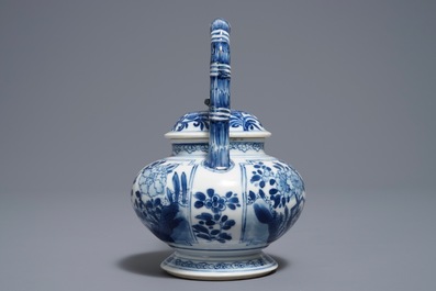 A Chinese blue and white gate-handled teapot and cover, Kangxi