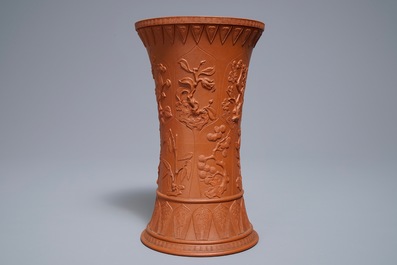 A Chinese Yixing stoneware beaker vase with applied floral design, Kangxi