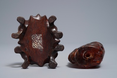 A Chinese carved amber group of a tiger below a pine tree and a dragon, 19/20th C.