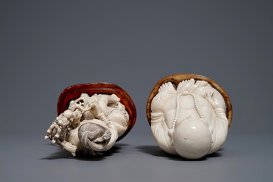 A Chinese ivory group of a family and a 'laughing Buddha' figure, ca. 1900