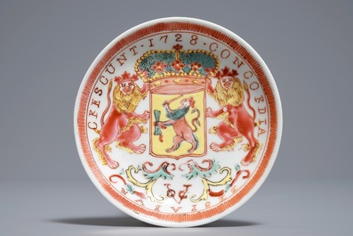 A Chinese famille rose armorial cup and saucer with VOC coat of arms, dated 1728, Yongzheng