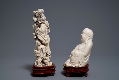 A Chinese ivory group of a family and a 'laughing Buddha' figure, ca. 1900