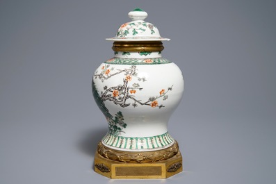 A Chinese famille verte gilt bronze-mounted vase and cover, 19th C.