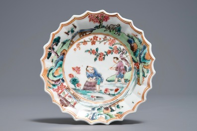 A Chinese famille rose cup and saucer with fishermen, Yongzheng