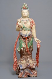 A tall Chinese painted and carved wood figure of Guanyin, 18/19th C.
