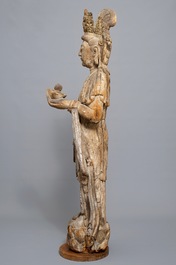 A tall Chinese carved wood figure of Guanyin, Ming